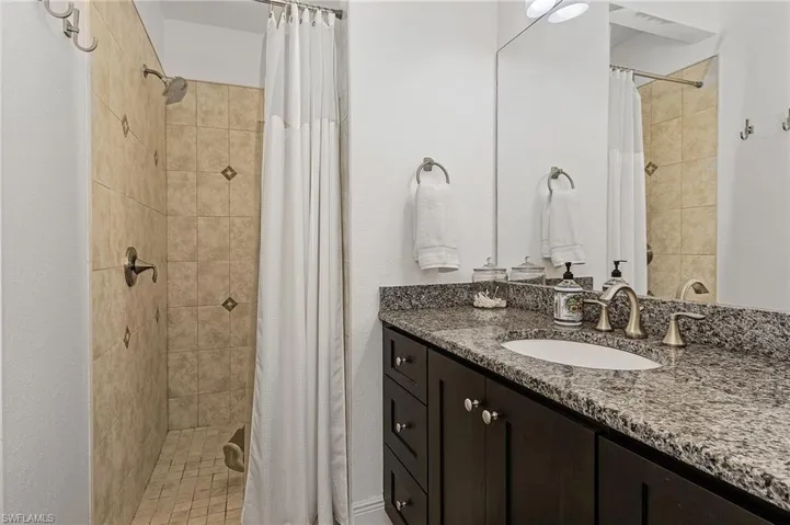 Bathroom with walk in shower and vanity