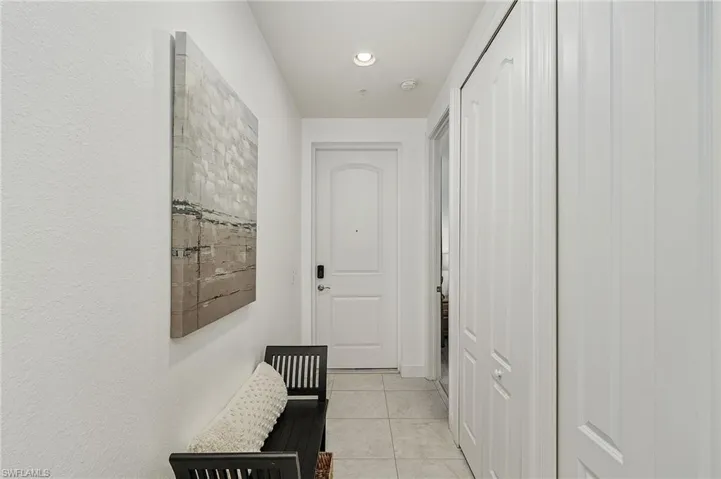 Entry hall with white tile flooring
