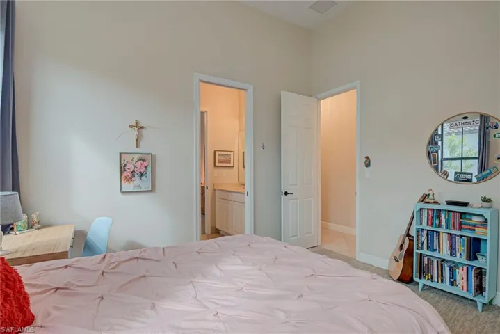 Bedroom #2 with light carpet and Jack N Jill Bath