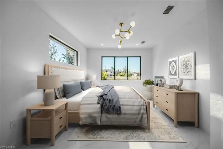 Virtually staged Bedroom featuring a chandelier