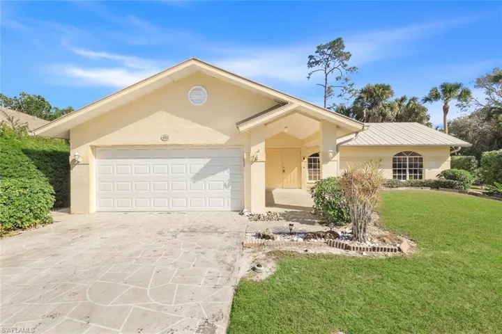 Front of house featuring a two car garage