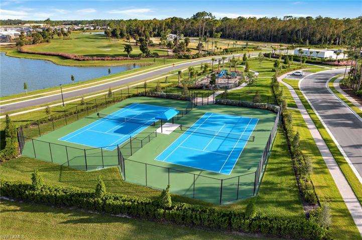 Tennis courts, playground, & view of golf course that the home sits on