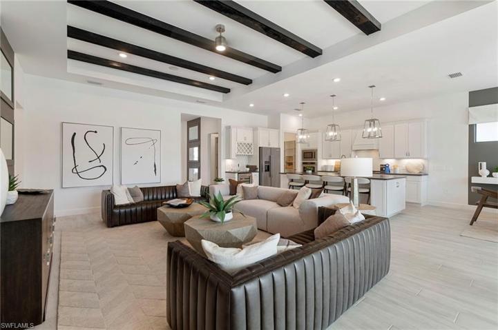 Great room & kitchen area shown furnished