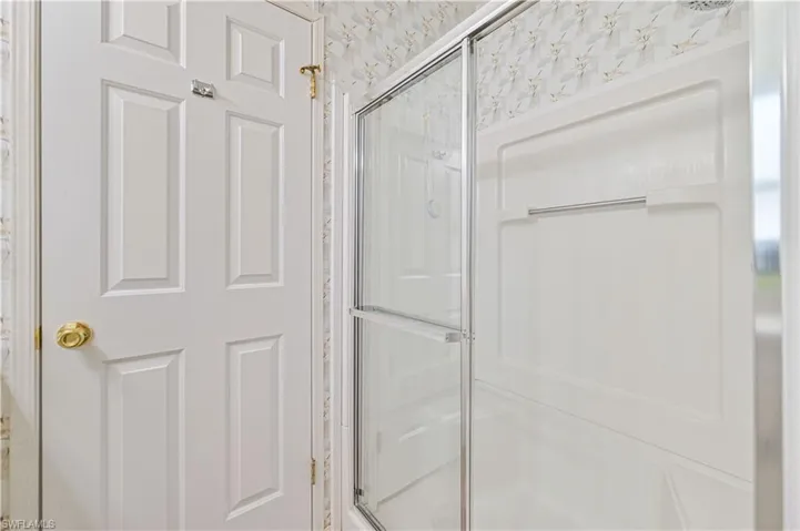 Bathroom with a shower with door