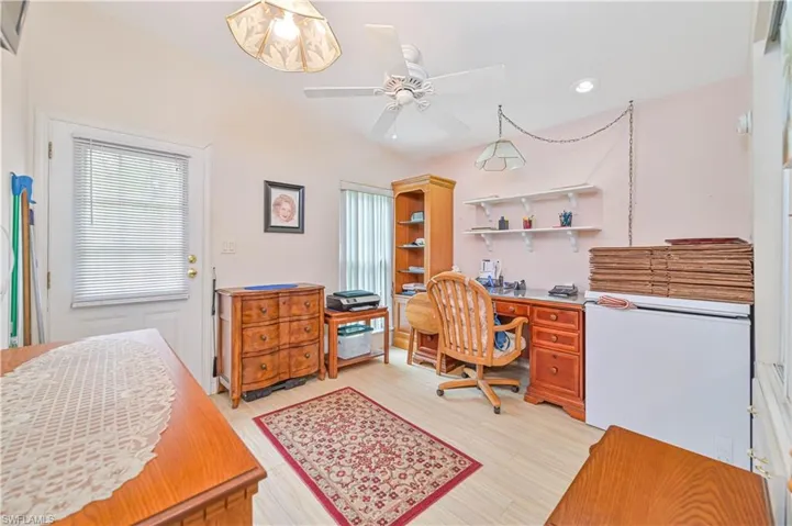 Home office featuring light hardwood / wood-style flooring and ceiling fan