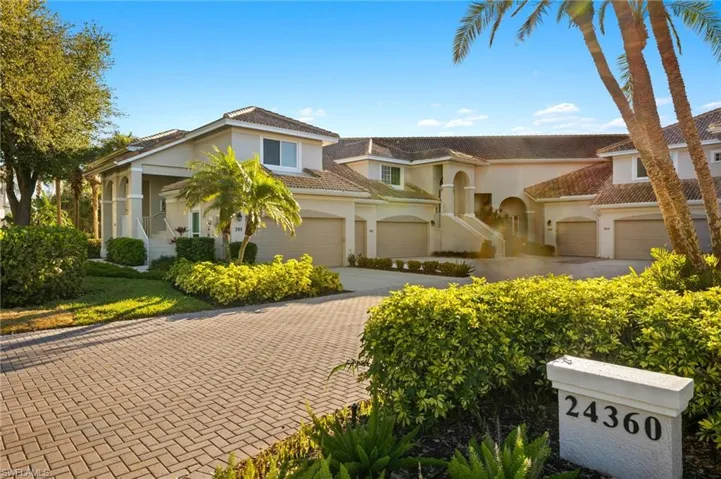 View of front of home featuring driveway, an attached garage, and stucco siding