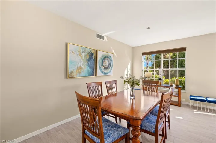 Dining room featuring light wood finished floors and baseboards