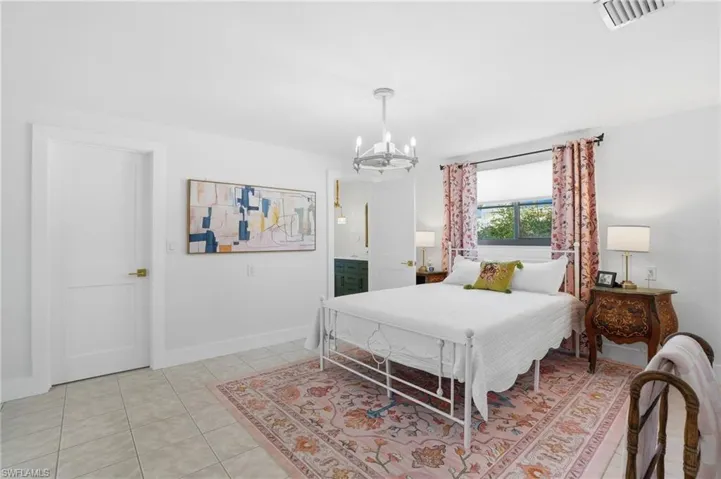 White tile flooring extends throughout this interior space - Virtually Edited Image
