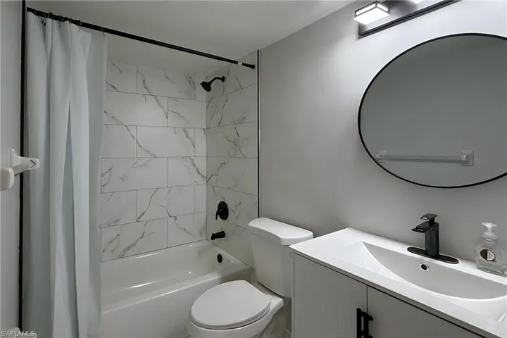 Full bathroom featuring vanity and shower / bath combo