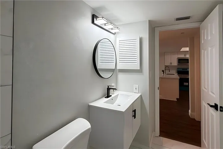 Bathroom featuring vanity and toilet