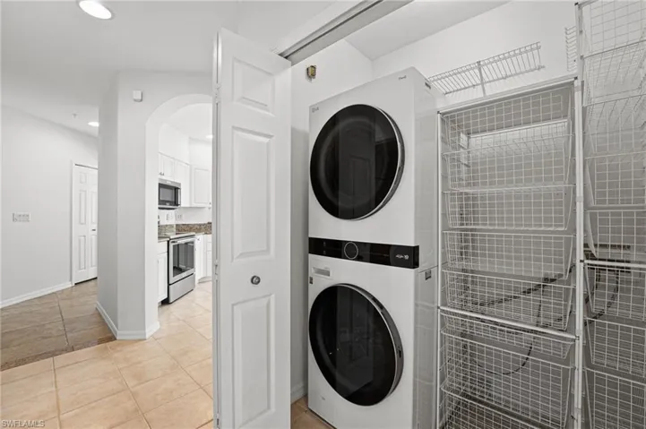Stack washer & dryer and storage.