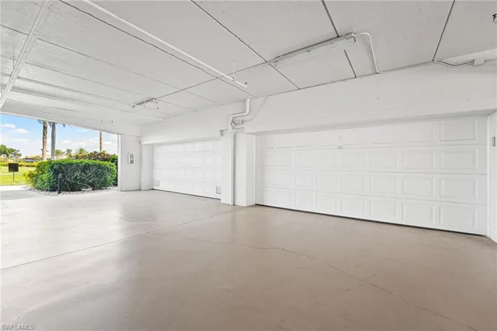 Under building enclosed OVERSIZED 2 car garage. Room for 2 cars and a golf cart!