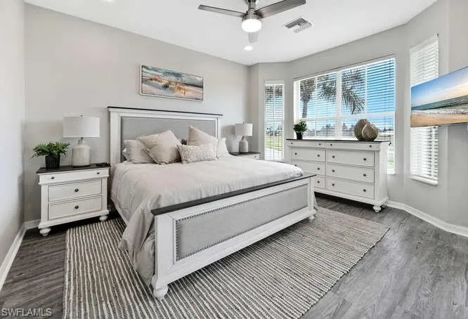 Bedroom featuring dark wood-type flooring, a ceiling fan, and recessed lighting