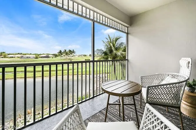 Balcony featuring view of golf course