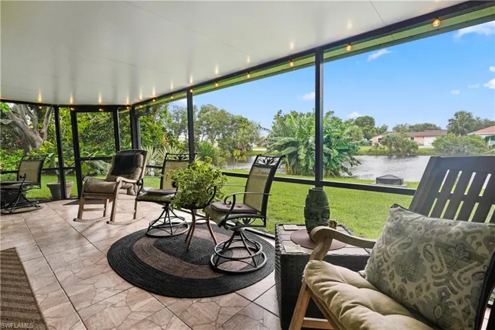 Sunroom / solarium with a water view