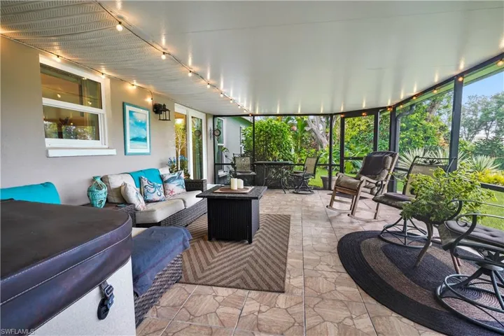 Sunroom with view of beautifully landscaped yard! Your own private oasis!