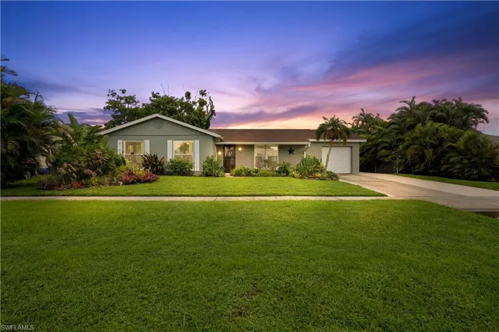 Ranch-style house with attached garage beatutiful yard  and extra driveway. !