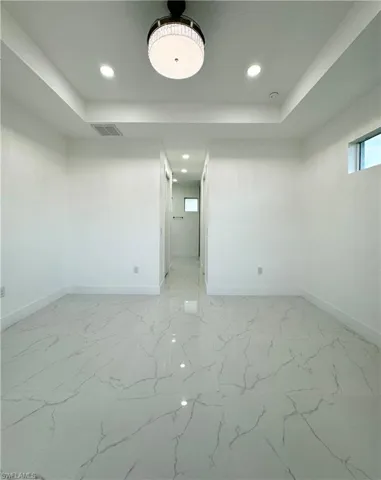Spare room featuring tile floors
