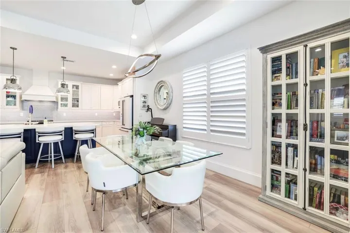 Dining space featuring sink and light wood-type flooring