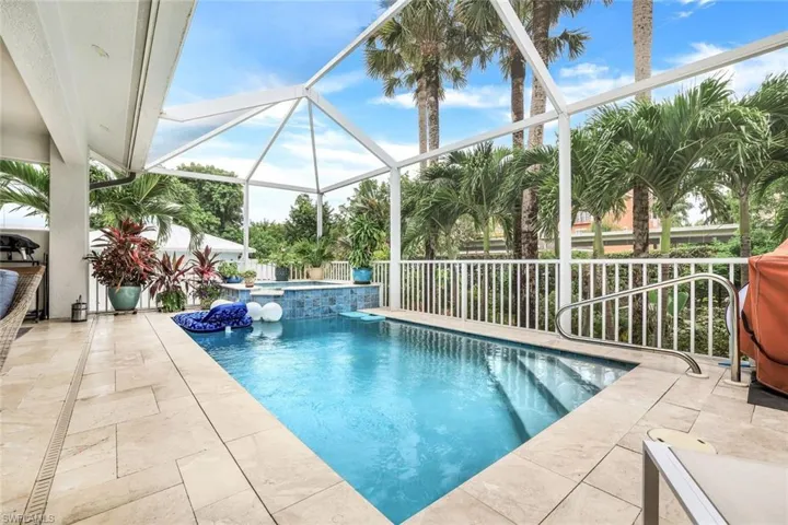 View of pool featuring a patio, an in ground hot tub, and sceen enclosure