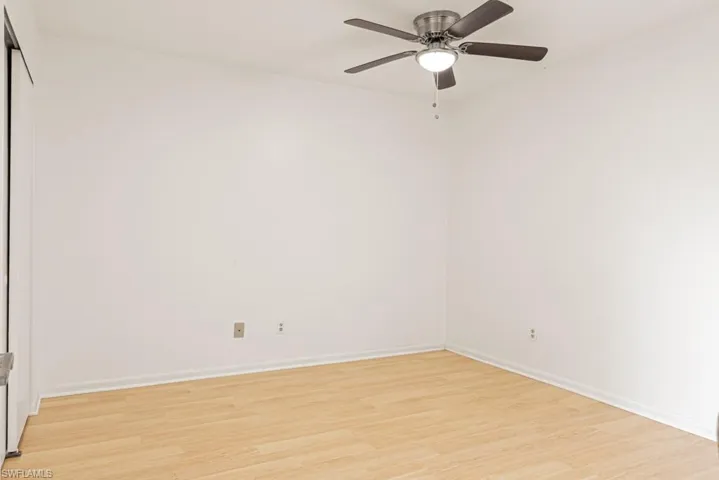 Unfurnished room featuring ceiling fan and light hardwood / wood-style floors