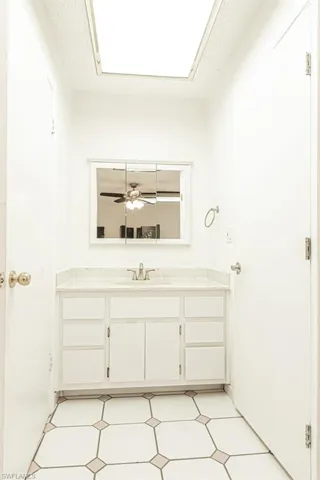 Bathroom featuring tile flooring, and oversized vanity