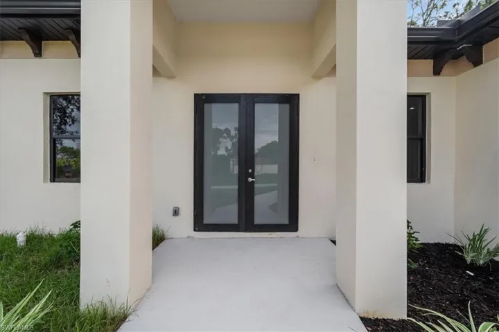 Doorway to property with french doors