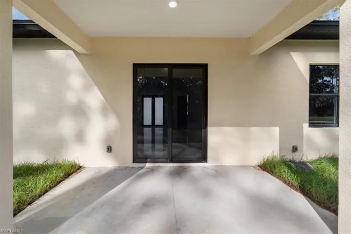 Entrance to property featuring a patio area