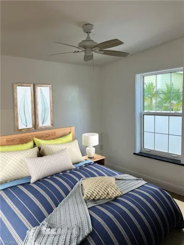 Bedroom with baseboards and ceiling fan