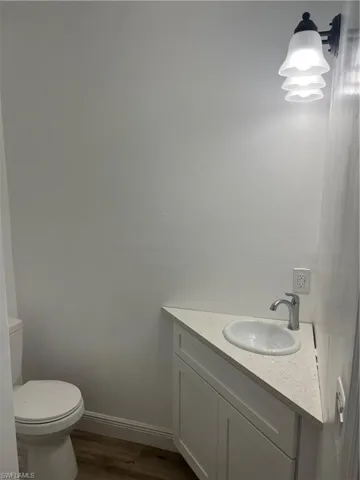 Bathroom featuring vanity and wood finished floors