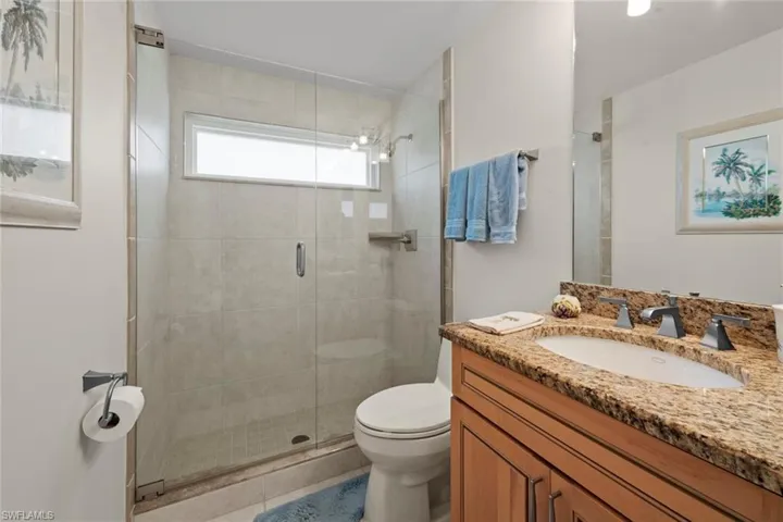 Updated guest bath with frameless shower doors