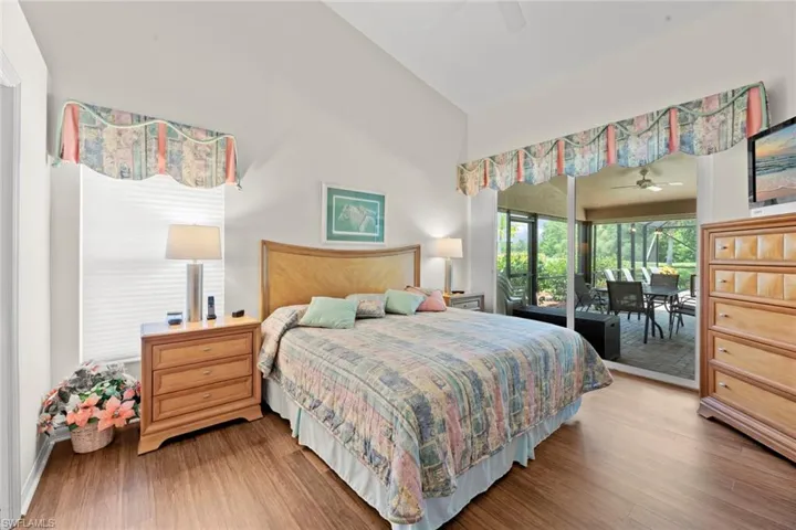 Master bedroom with beautiful luxury vinyl floors and access to lanai