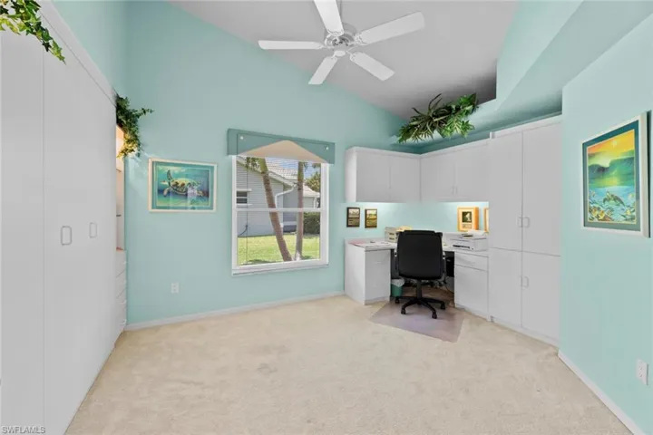 Den/Study with Built in desk and cabinets as well as a murphy bed