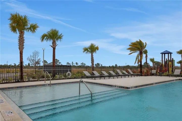 Community pool with a patio area