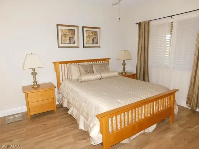 Bedroom with wood finished floors