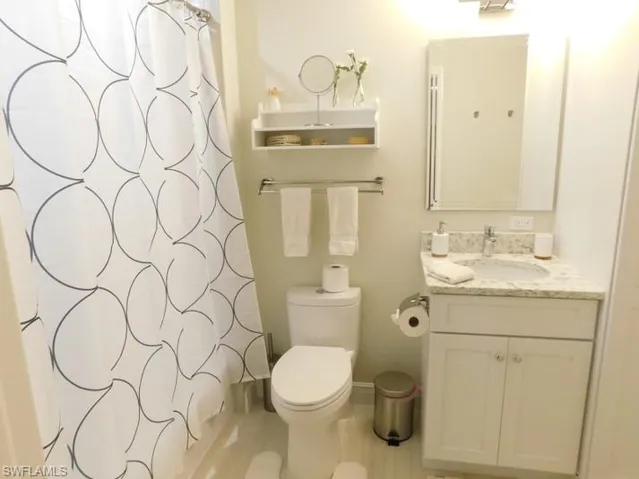 Bathroom featuring vanity and a shower with curtain