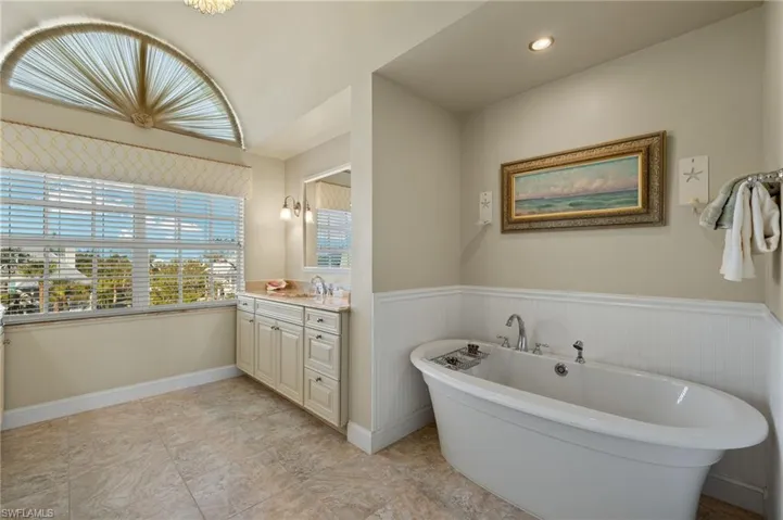 Bathroom with vanity and a bathing tub