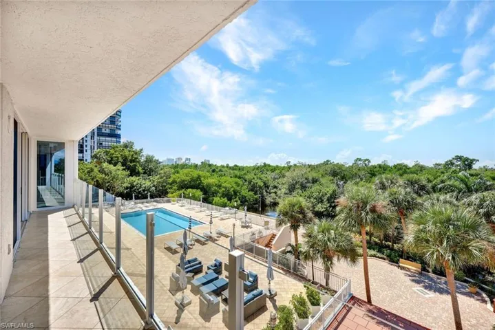 View of large pool from 2nd floor balcony offering amazing sunsets every night!
