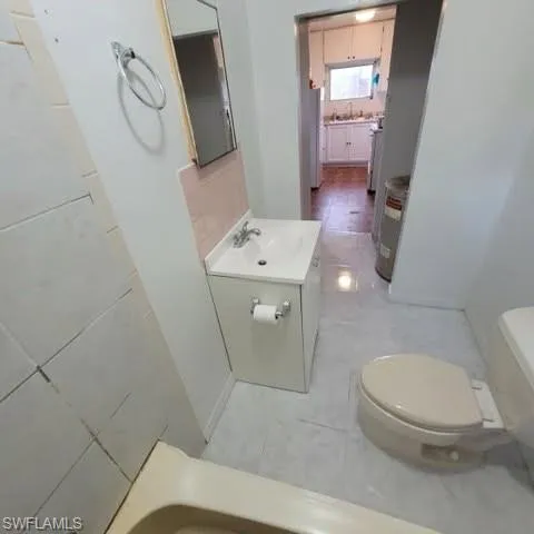Bathroom with vanity and tile patterned flooring