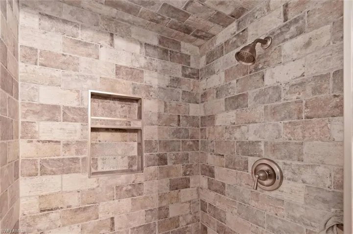 Guest Bathroom Room details featuring a tile shower
