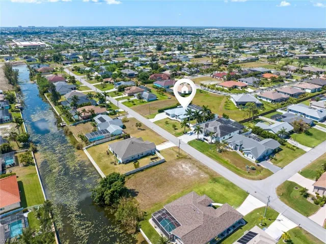 Bird's eye view with a water view and a residential view