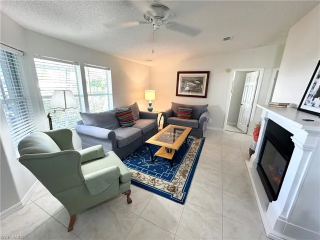 Spacious living room complete with fireplace