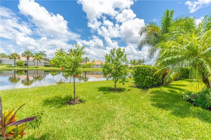 View of yard with a water view