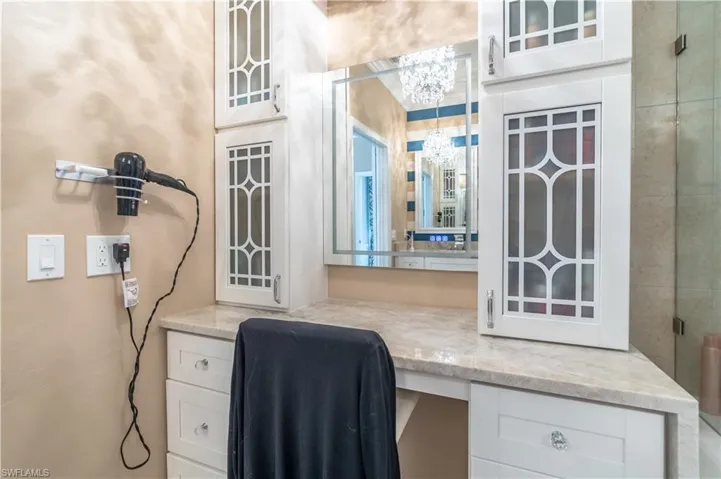 Office space with a notable chandelier