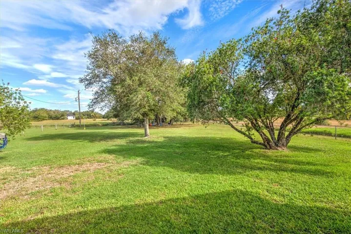 View of yard with a rural view