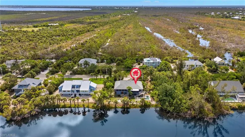 Aerial view of residential area with a large body of water