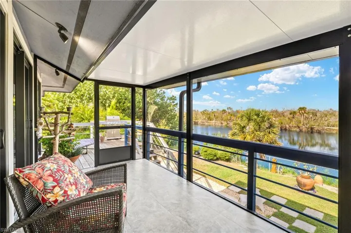 Sunroom with a water view