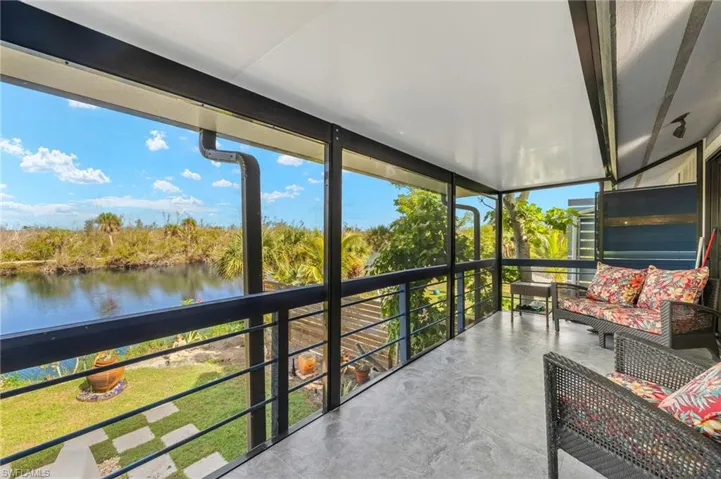 Sunroom with a water view