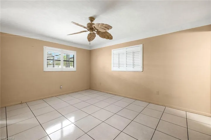 Unfurnished room featuring light tile
