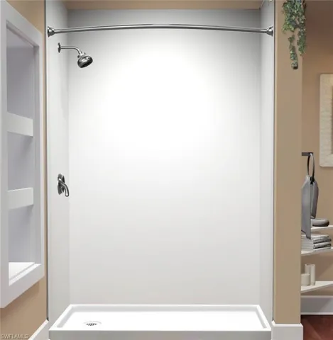 Full bath featuring a shower stall